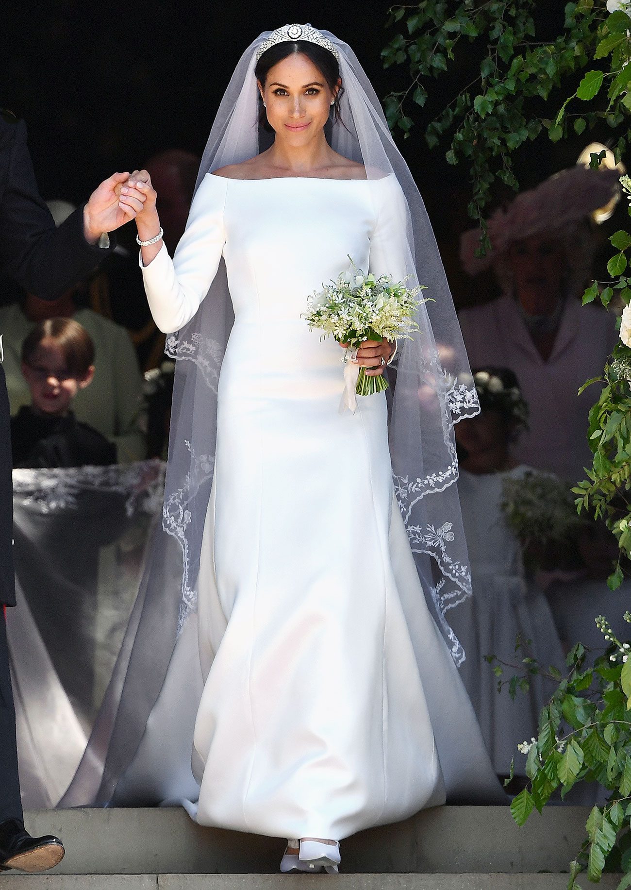 People.com That's an expensive dress you got there, Meghan.